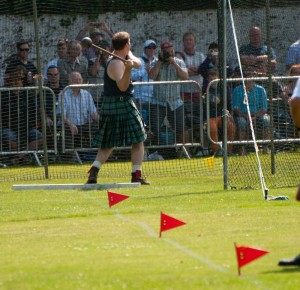 Scots hammer thrower wearing traditional outfit